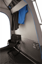 An internal look at the tent with two towels hanging and a camper chair