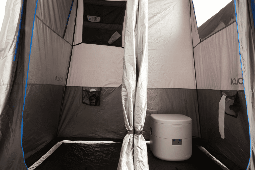 An internal look at a shower tent showing two seperate rooms, one for showering and another with a toilet in it