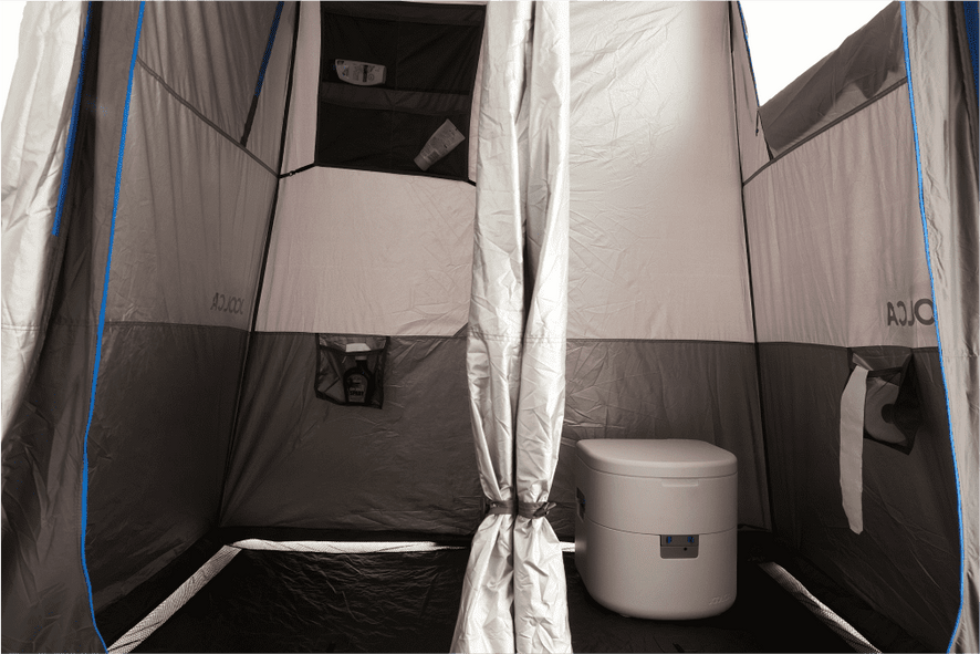 An internal look at a shower tent showing two seperate rooms, one for showering and another with a toilet in it