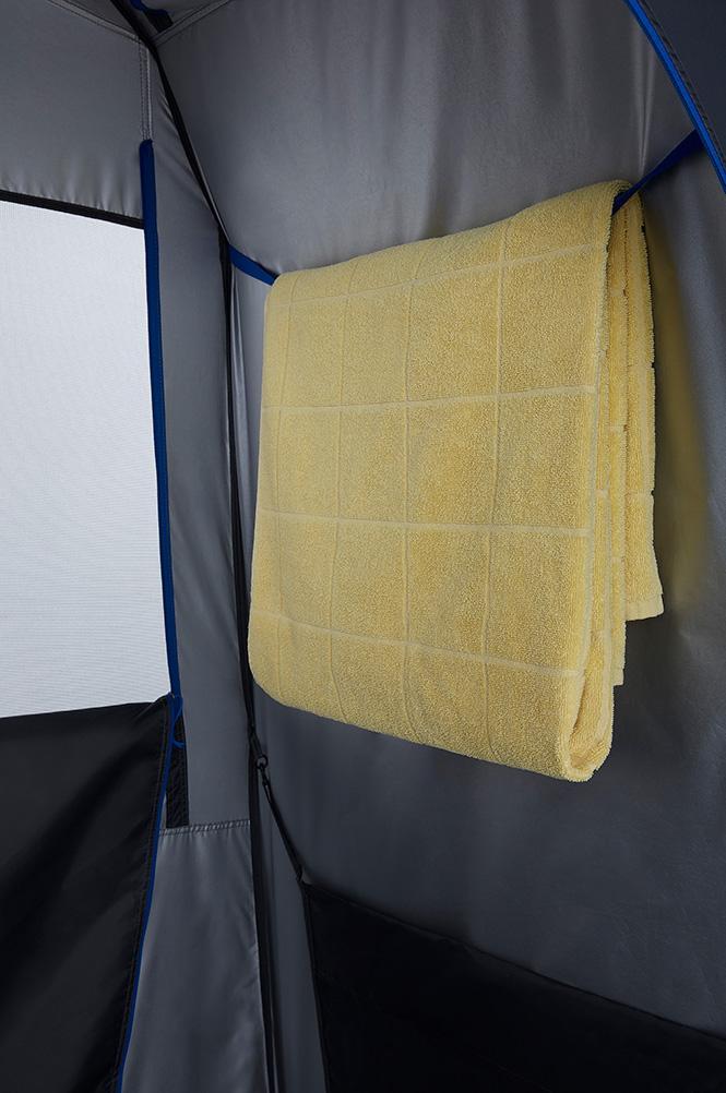 An internal look at a yellow towel hanging inside a tent