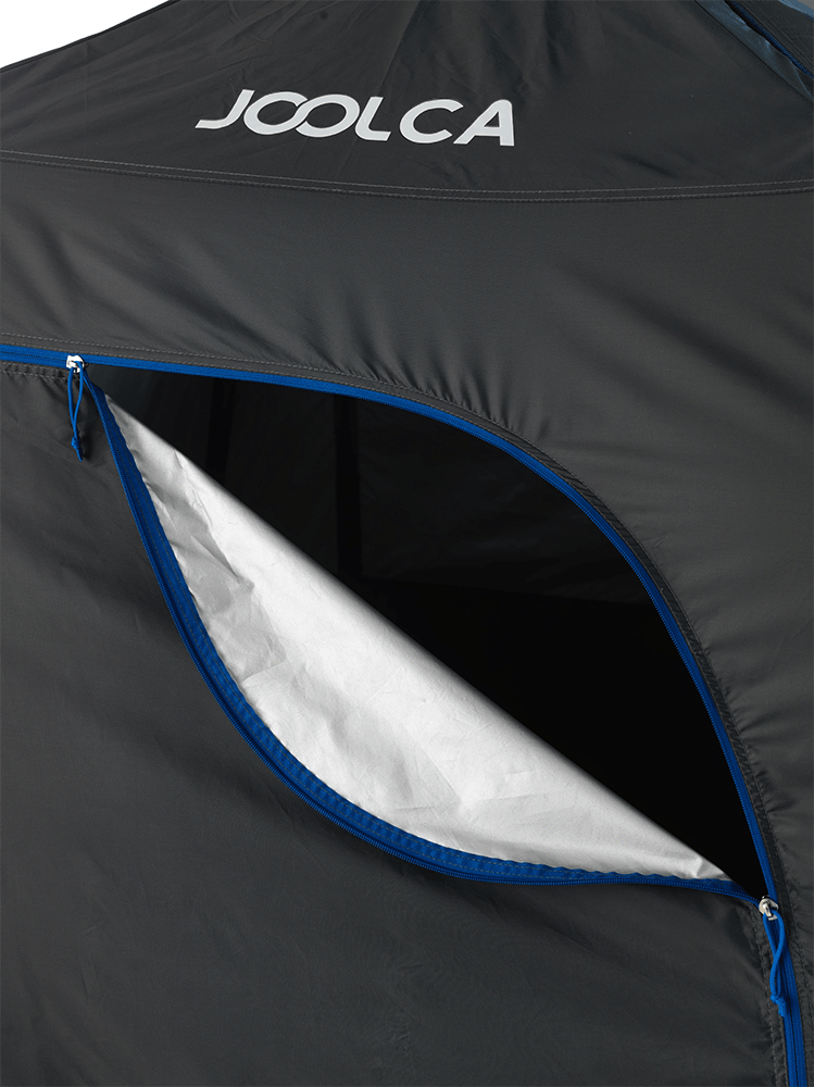 A slightly opened close up of the top of the tent
