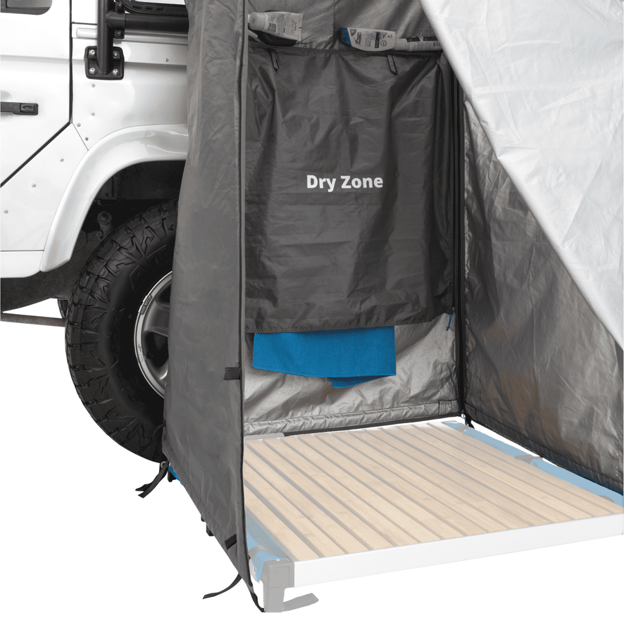 An open mounted shower tent with a covered hanging towel with 