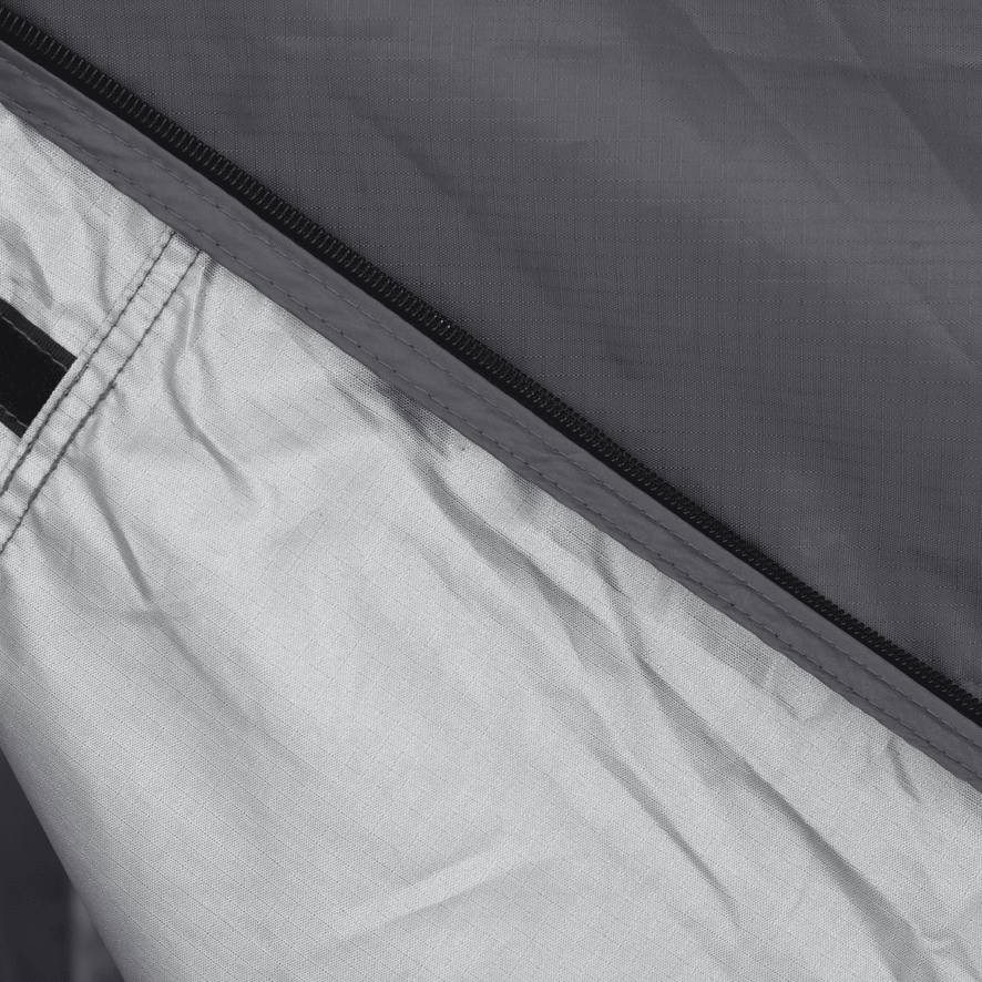 A close up of a zipper on a tent