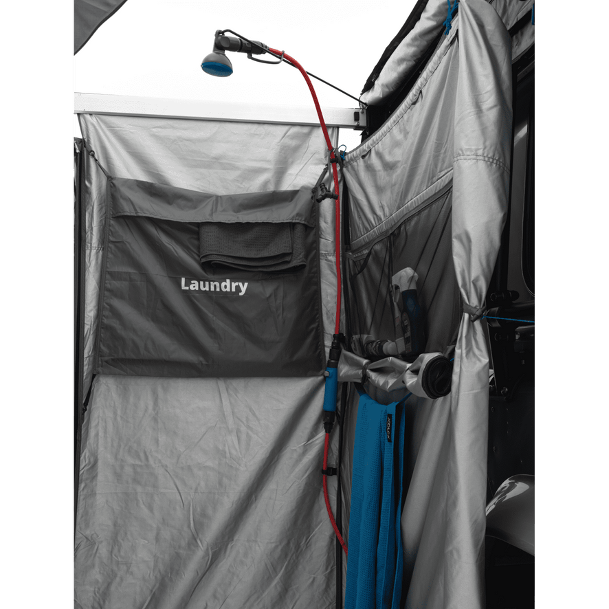 Internal view of a mounted shower tent, displaying the text