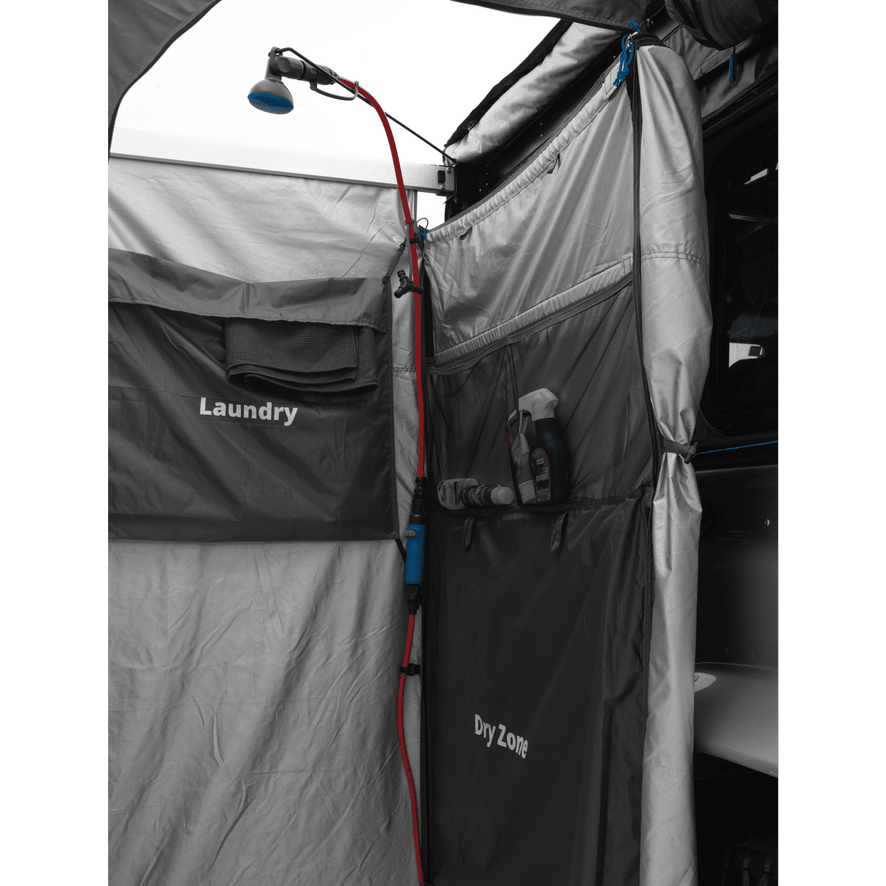 Internal view of a mounted shower tent, displaying the text