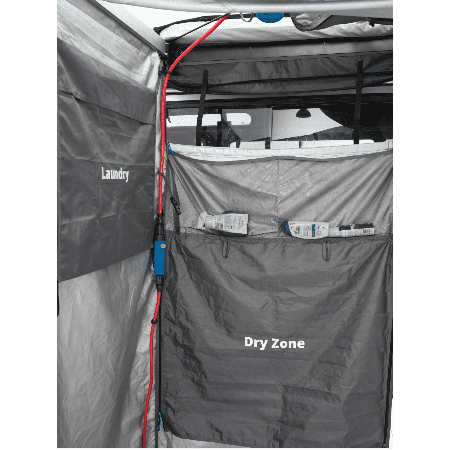Internal view of a mounted shower tent, displaying the text 