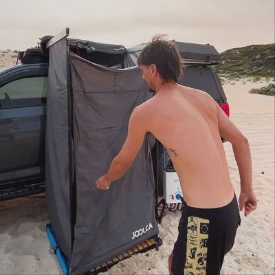 ENSUITE Mounted Single roof-rack shower tent in use