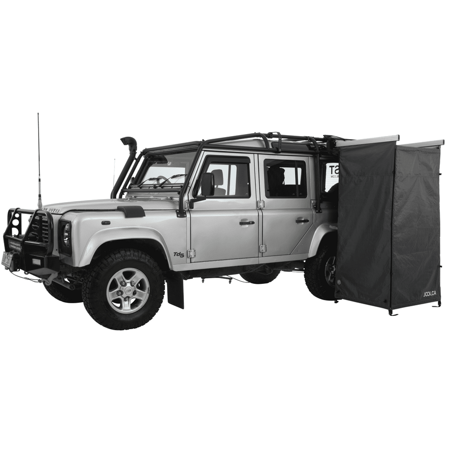 A side angle of a land rover 4WD with a mounted single Joolca branded shower tent attached 